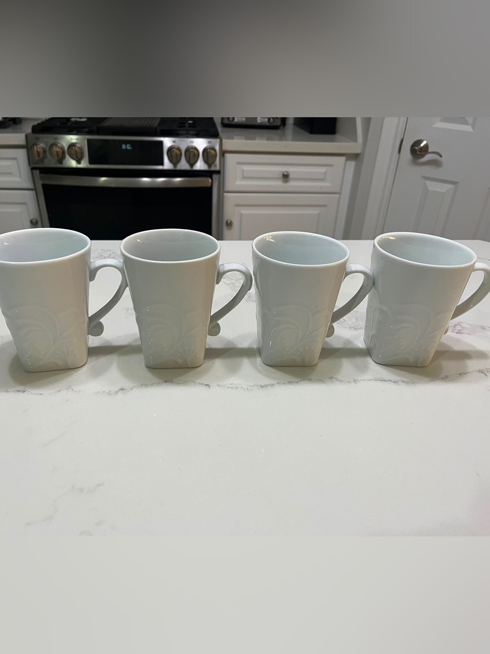 Set of 4 White Ceramic Mugs with Subtle Embossed Detail